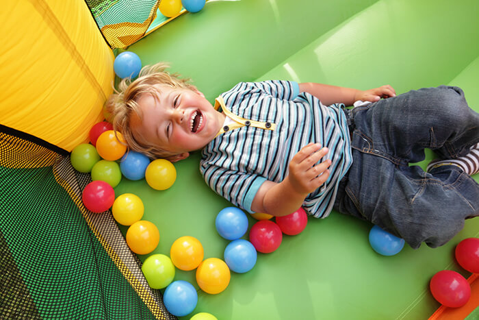 Young child enjoying a kids party play area
